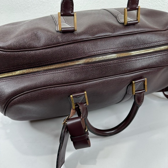 LV38 LOUIS VUITTON Taiga travel bag with strap - Picture 7 of 14